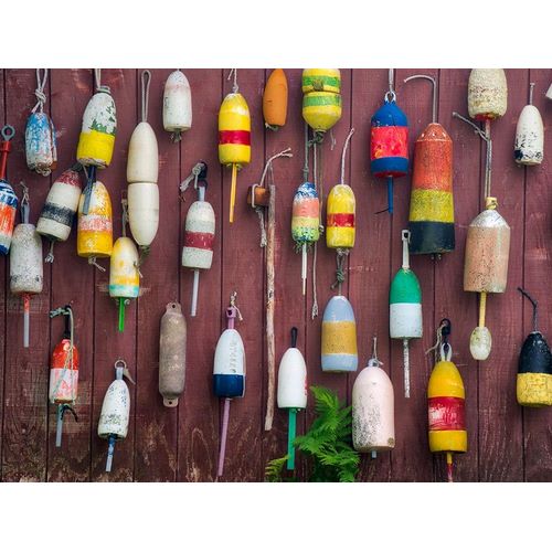 Maine Colorful buoys hanging on the exterior of a building